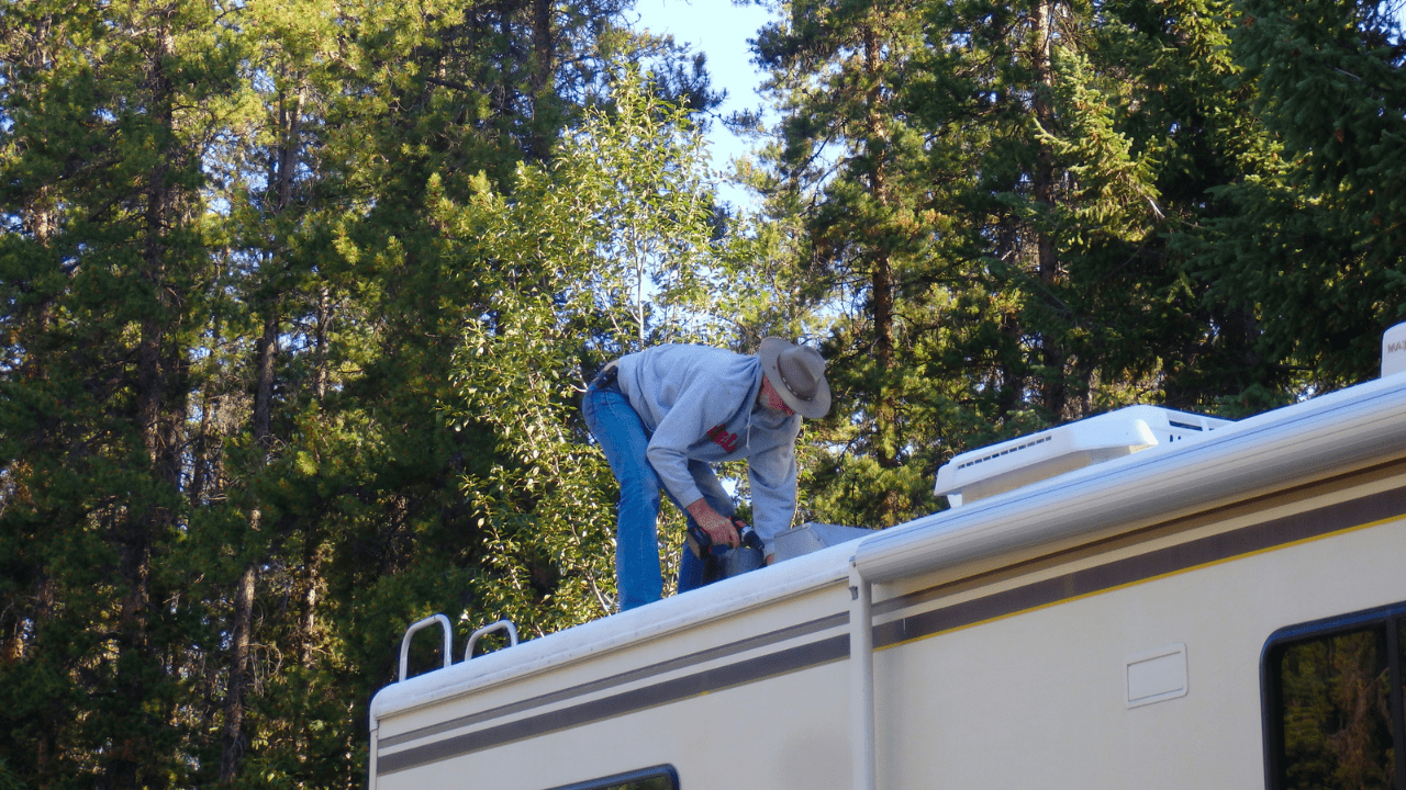 Man working on the roof of his RV
