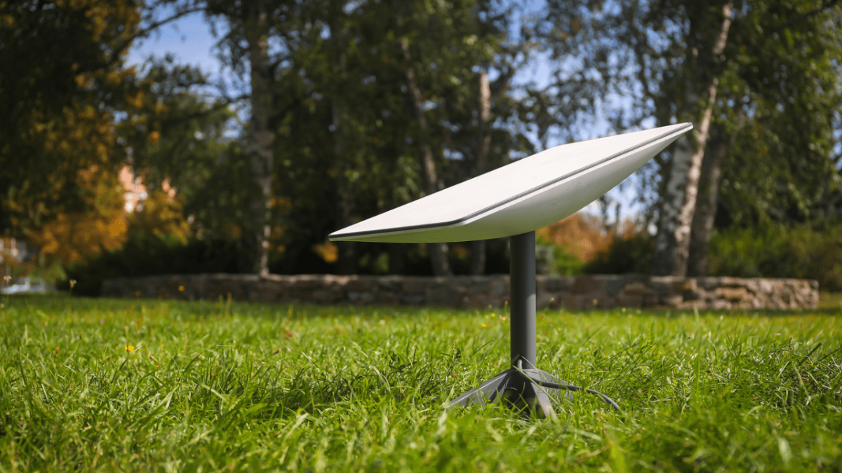 A Starlink satellite dish in the grass - © Oleh Dubyna