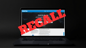 NHTSA website on a laptop screen with the text RECALL overlayed
