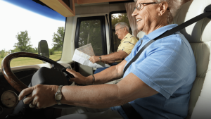 Senior coupe driving an RV