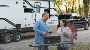 A couple cooking at an RV Campground