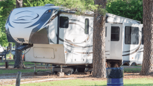 A fifth wheel parked at an RV park