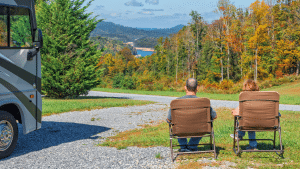 RV couple enjoying the view at a campsite