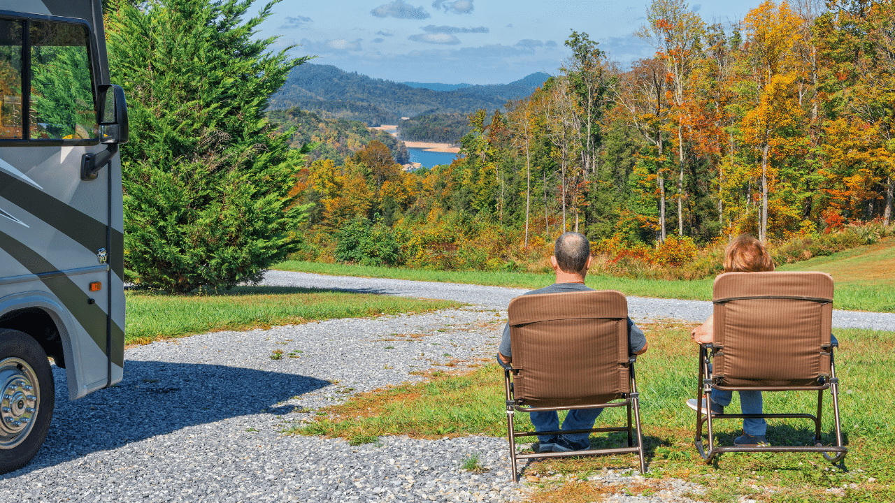 RV couple enjoying the view at a campsite