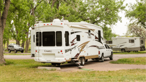 Truck and fifth wheel camping at a park Dreamstime Licensed 42119218
