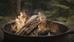 A campfire in a metal firepit ring