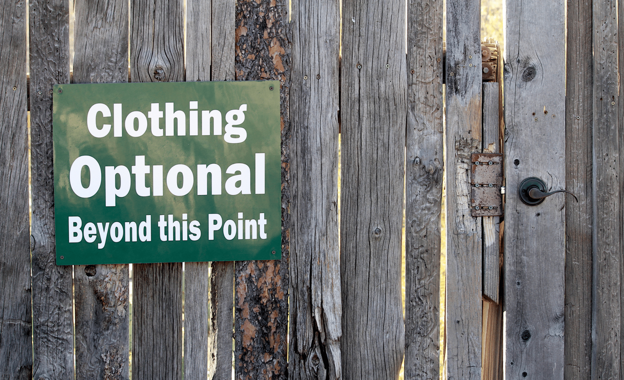 Clothing optional sign