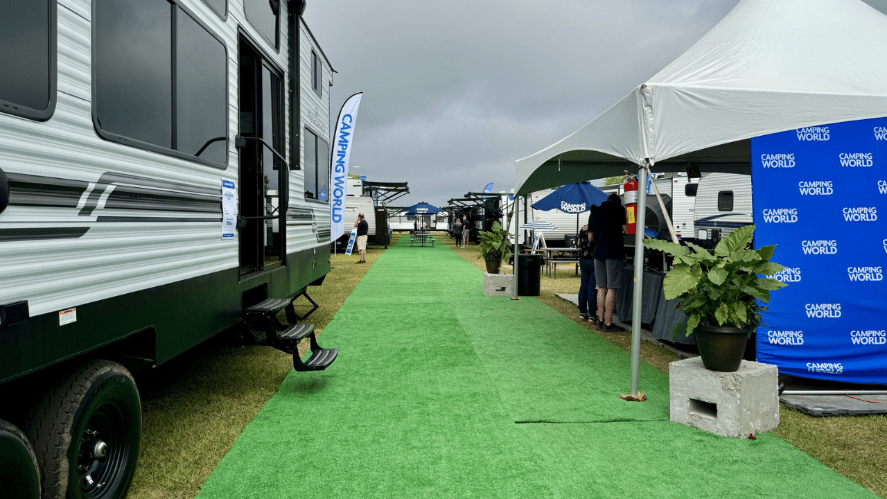 People looking at campers at an RV Show in Orlando, Florida