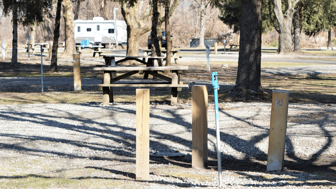A water and electric hookup at an RV campsite