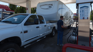 A man fills up his truck with diesel