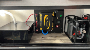 An inverter/charger installed in an RV electrical compartment