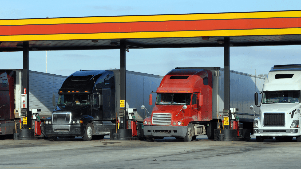 Diesel trucks and motorhome refueling at station
