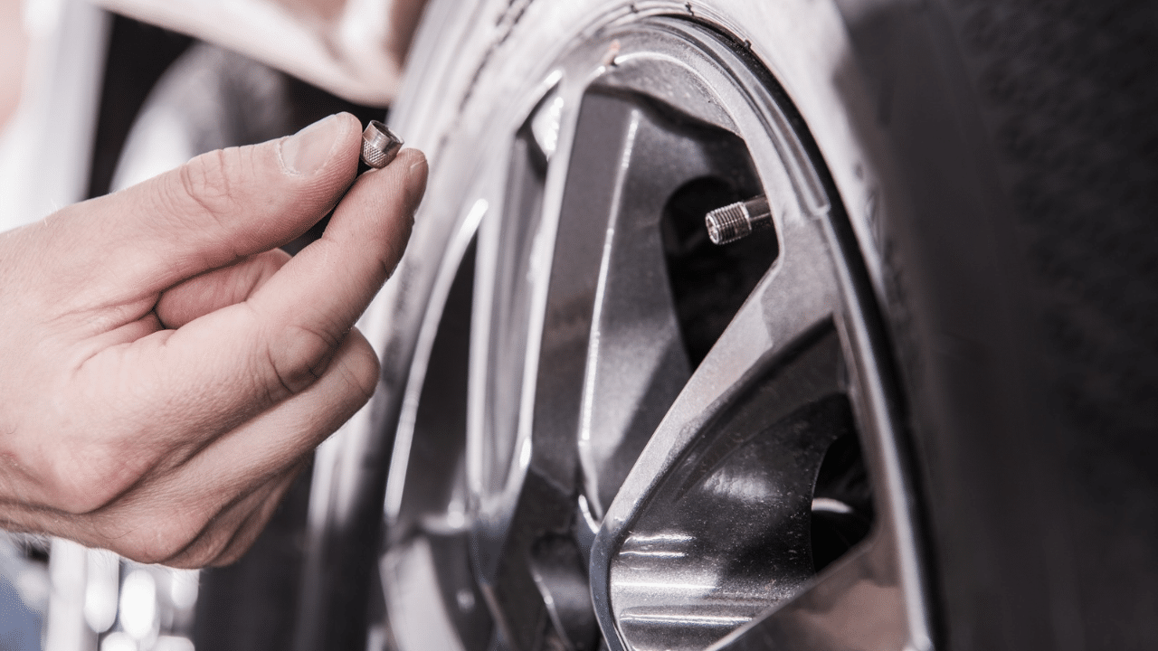 Man checking RV tire pressure